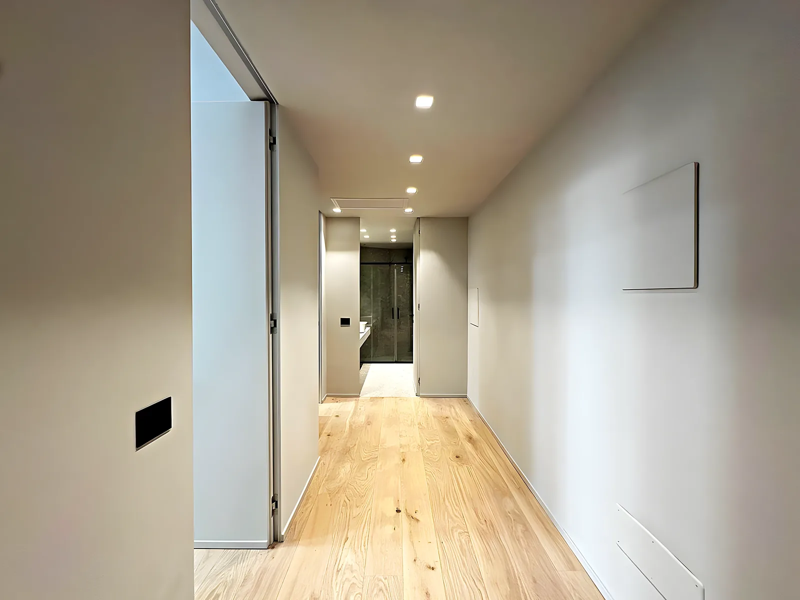 Living room with an open kitchen after a full flat renovation in Málaga